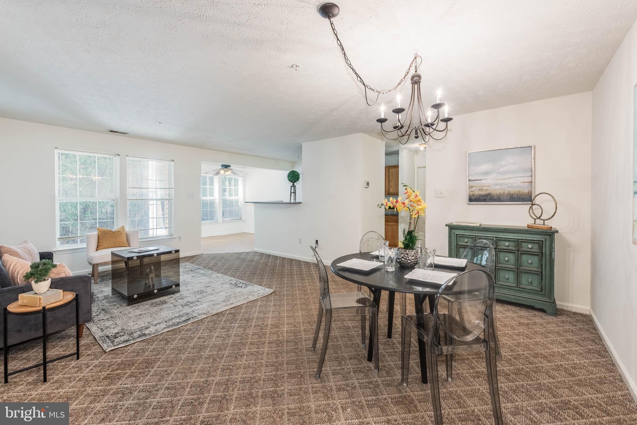 9715 Reese Farm Road, Unit 9715 Owings Mills, MD 21117 - Photo 7 of 25 a view of a dining room with furniture window and outside view