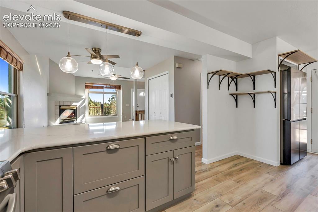 17370 Sweet Road Peyton, CO 80831 - Photo 23 of 38 Kitchen is all new with decorative light fixtures, white granite countertops, lots of storage and all appliances included.
