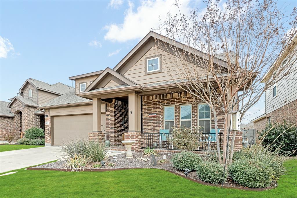 916 Falcon Road Argyle, TX 76226 - Photo 2 of 37 View of front facade featuring a garage and a front yard