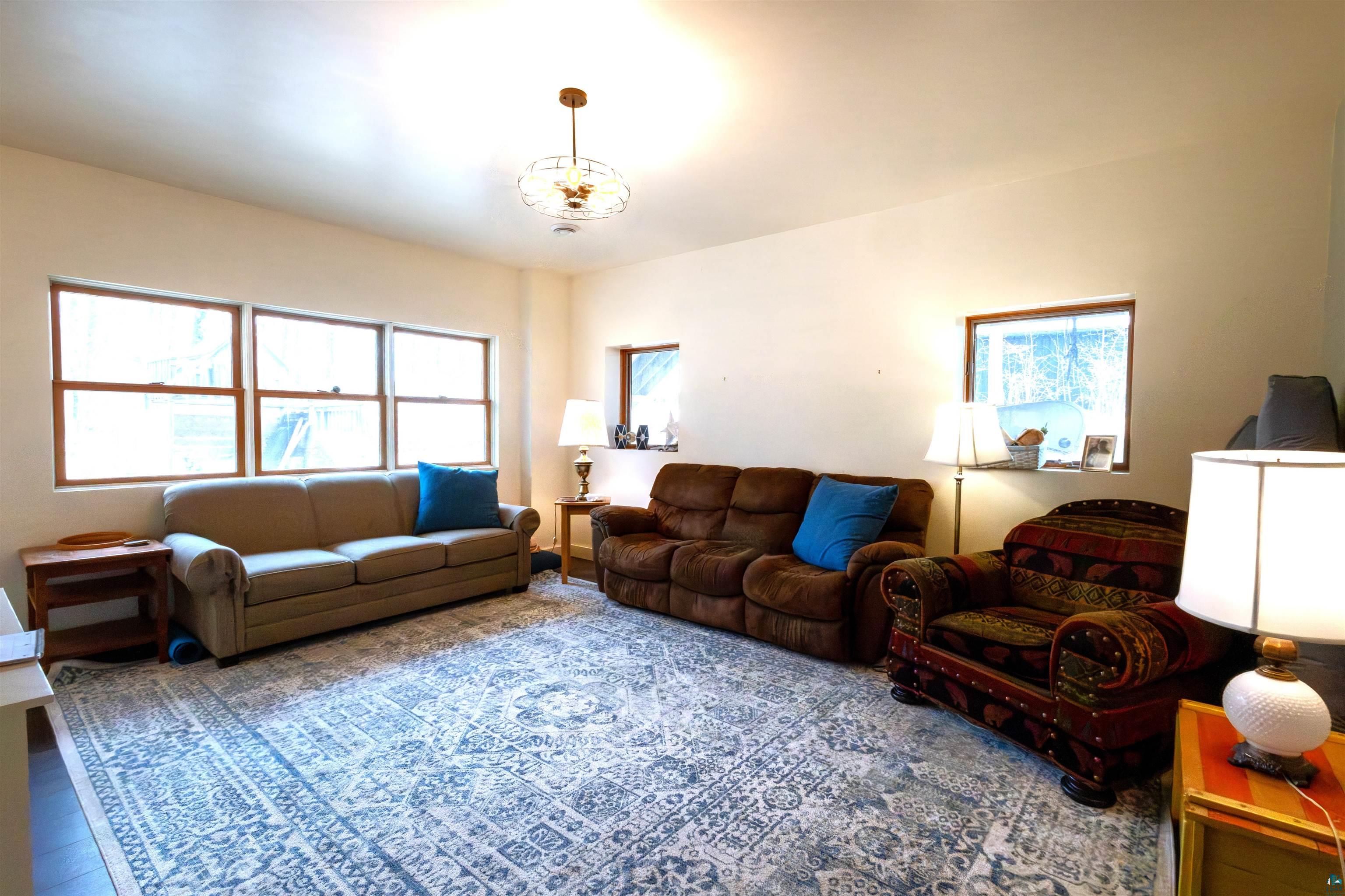 20210 Siskiwit Lake Road Cornucopia, WI 54827 - Photo 30 of 40 lower level living room