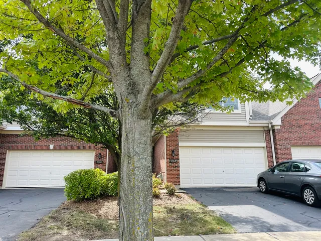 a view of a car parked in front of a house