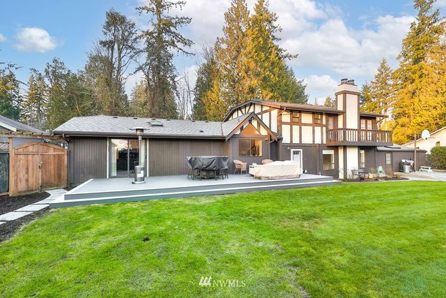 a front view of house with yard outdoor seating and green space