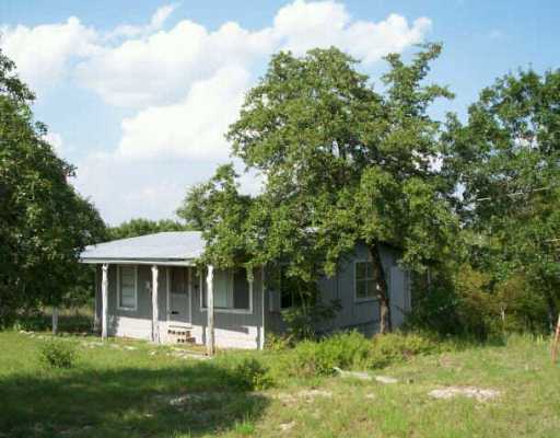 0 Windy Hills Road Dripping Springs, TX 78620 - Photo 1 of 1 a front view of a house with a yard