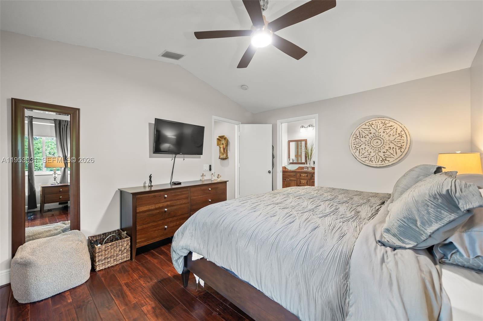 4036 Pine Ridge Lane Weston, FL 33331 - Photo 12 of 19 a spacious bedroom with a bed and a flat screen tv