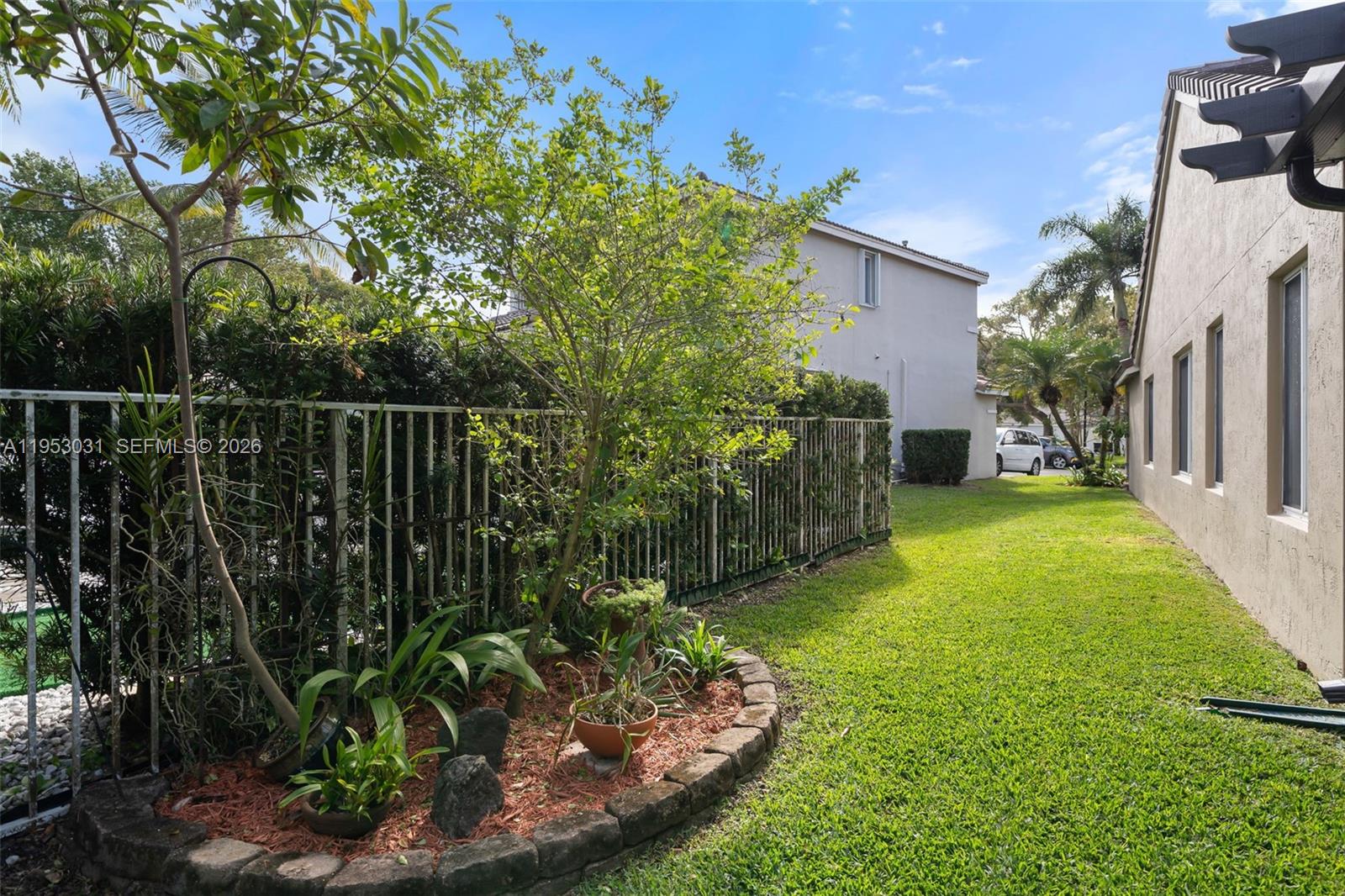 4036 Pine Ridge Lane Weston, FL 33331 - Photo 15 of 19 a view of a backyard with plants