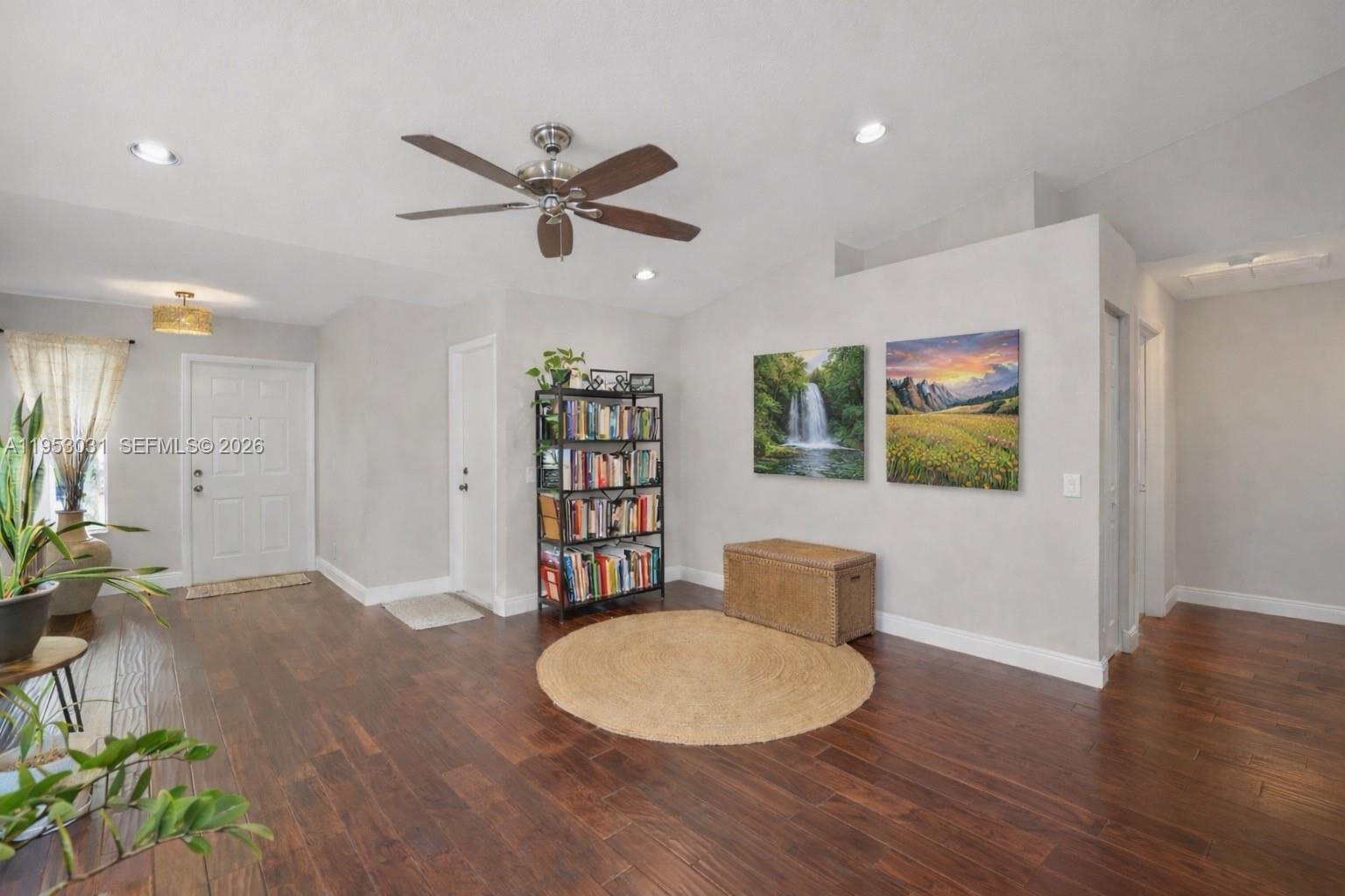 4036 Pine Ridge Lane Weston, FL 33331 - Photo 2 of 19 a living room with furniture and a wooden floor