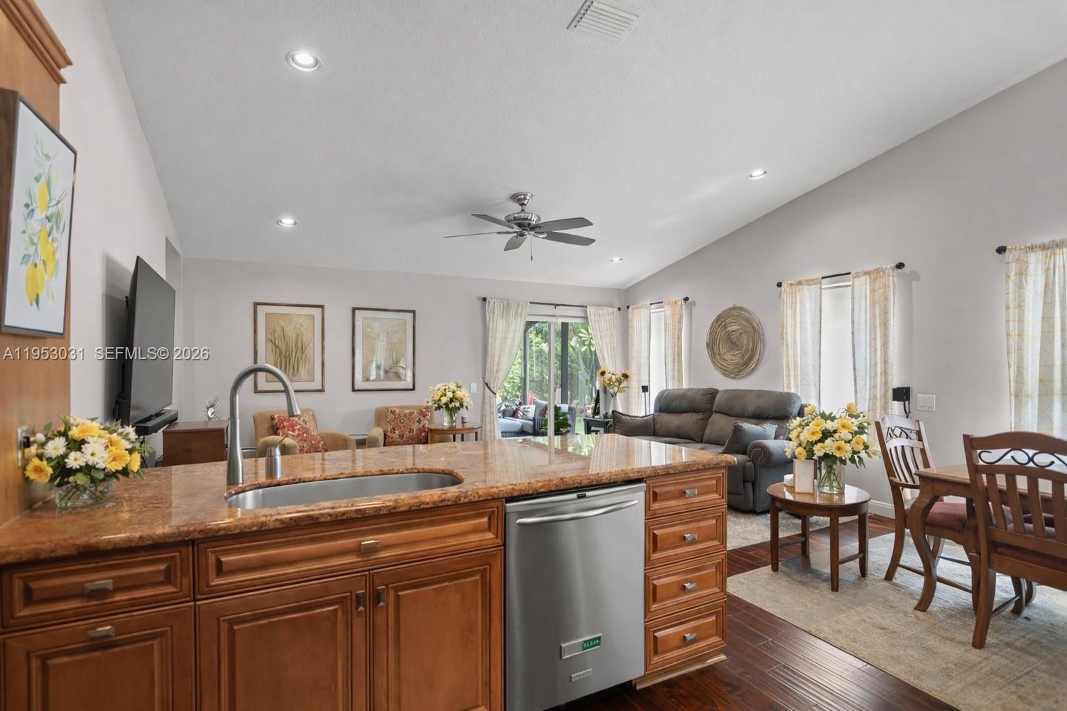 4036 Pine Ridge Lane Weston, FL 33331 - Photo 8 of 19 a living room with furniture a dining table and chairs