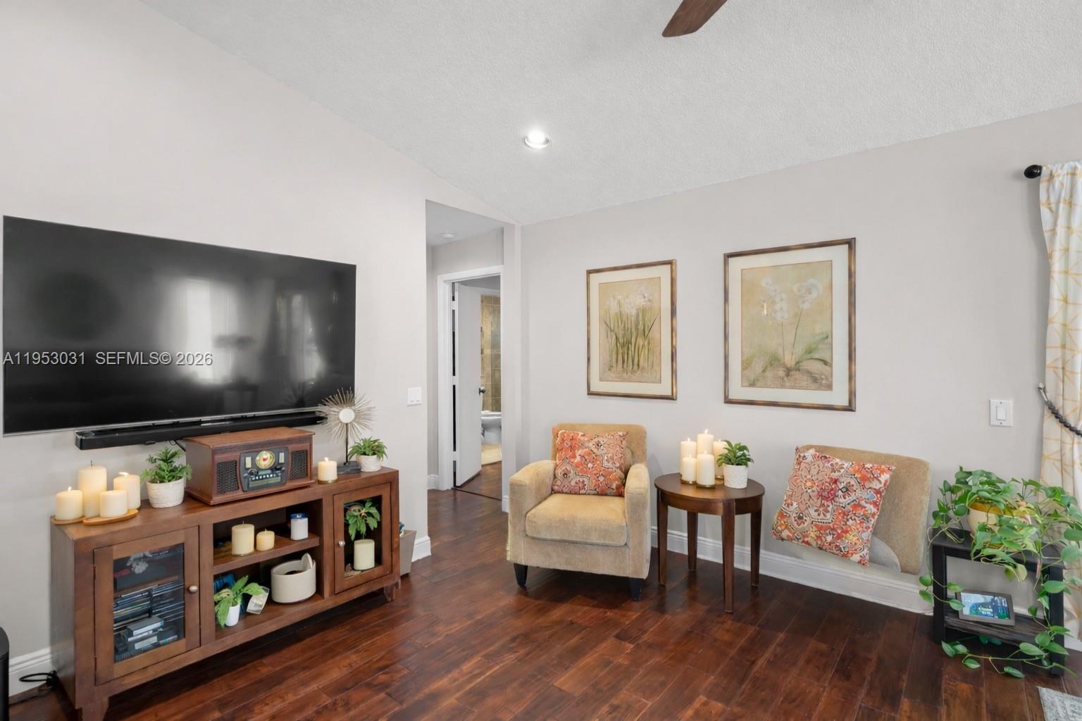 4036 Pine Ridge Lane Weston, FL 33331 - Photo 9 of 19 a living room with furniture and a flat screen tv