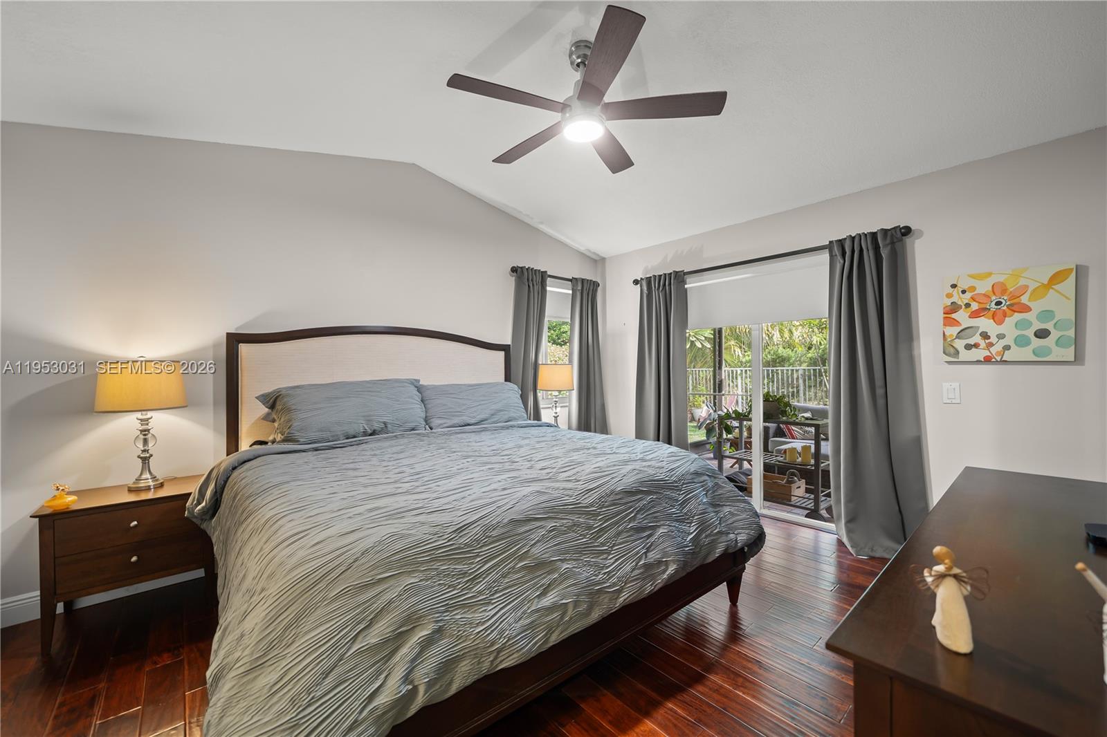 4036 Pine Ridge Lane Weston, FL 33331 - Photo 10 of 19 a bedroom with a bed and wooden floor