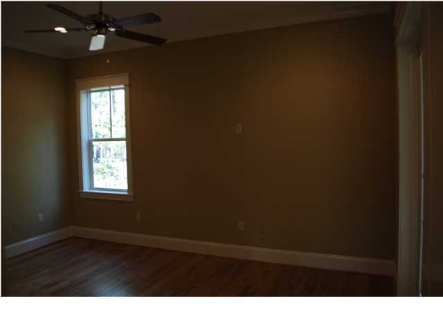 153 Matt's Way Santa Rosa Beach, FL 32459 - Photo 7 of 29 a room with a window and wooden floor