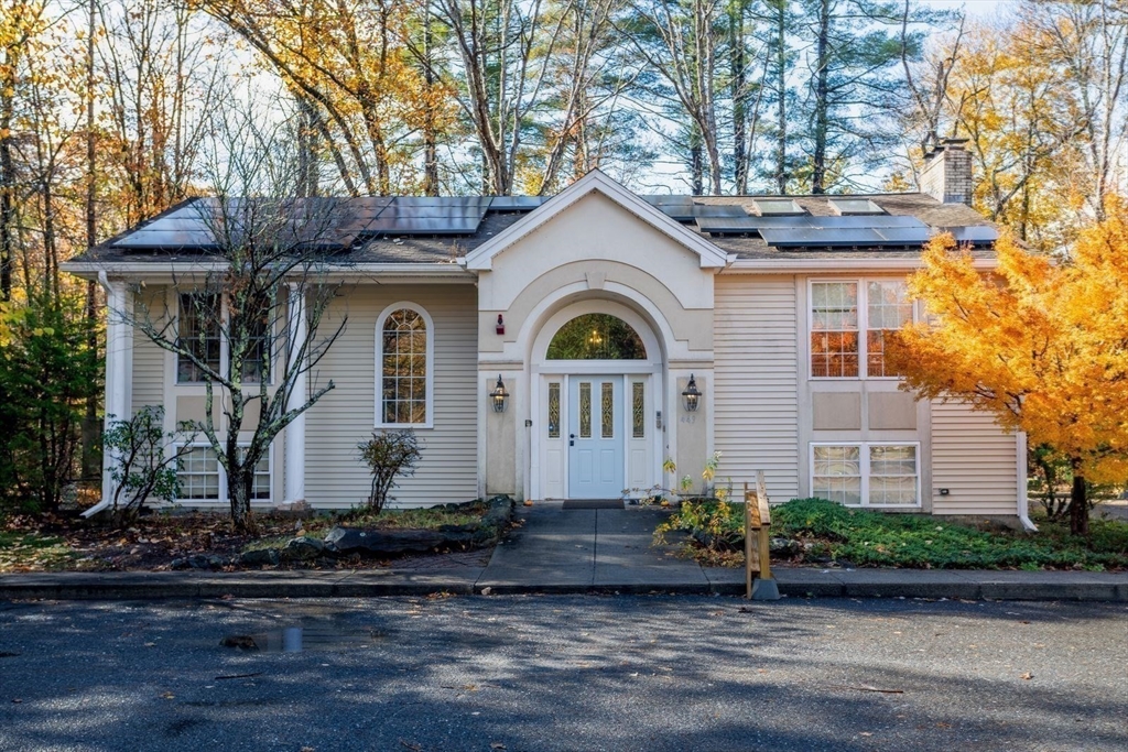 a front view of a house with garden
