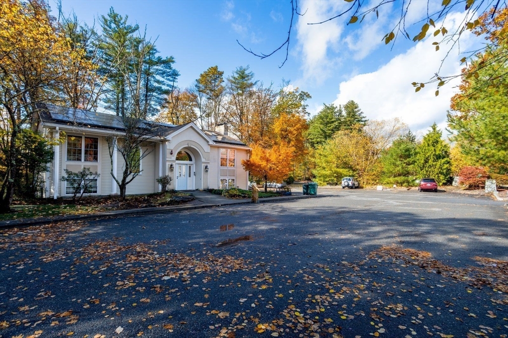 449 Berlin Street Clinton, MA 01510 - Photo 6 of 7 a front view of a house with garden