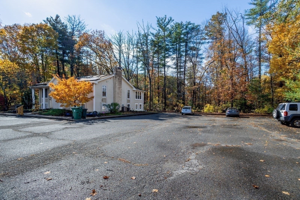 449 Berlin Street Clinton, MA 01510 - Photo 7 of 7 a view of a house with a yard and garage