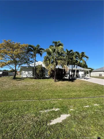 a view of a house with a big yard