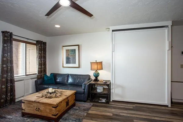 a living room with a couch and a window