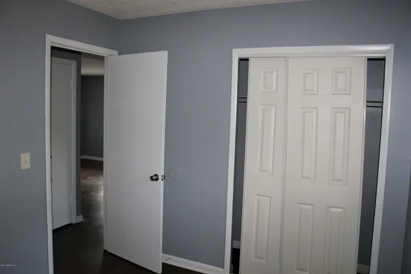 a bathroom with a toilet a sink and bathtub