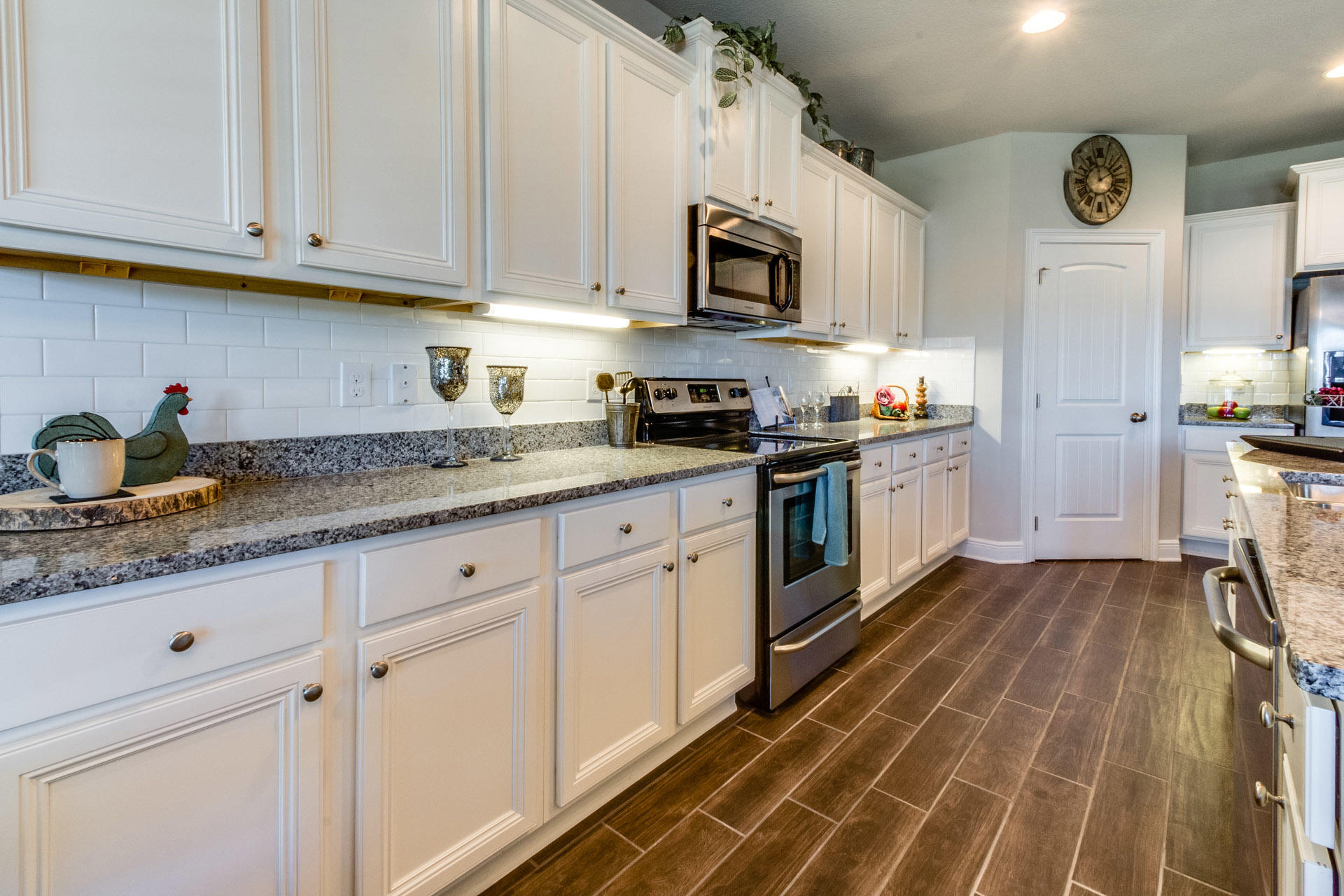 579 Golf Club Drive Santa Rosa Beach, FL 32459 - Photo 13 of 33 a kitchen with granite countertop cabinets stainless steel appliances and a counter space