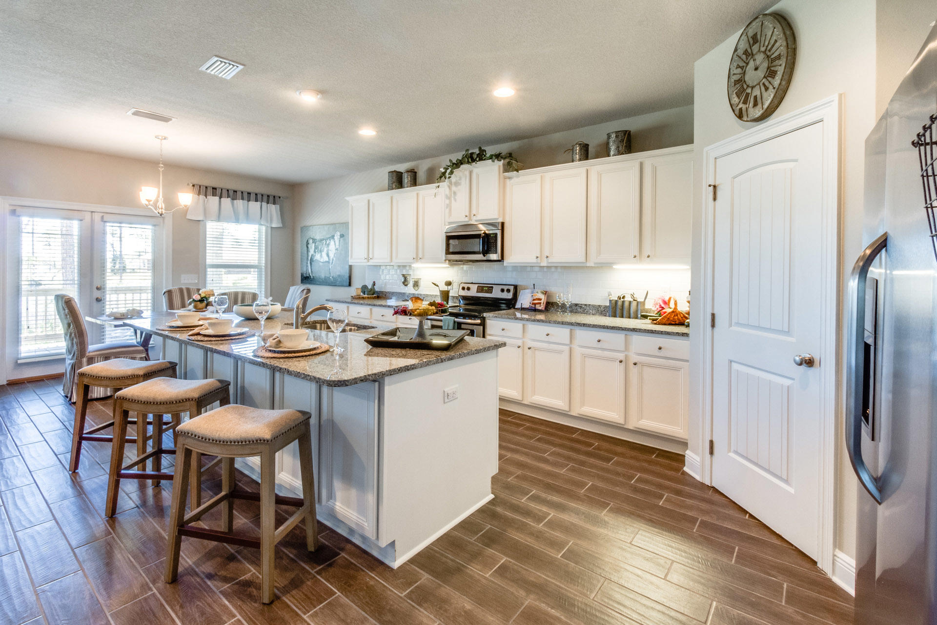 579 Golf Club Drive Santa Rosa Beach, FL 32459 - Photo 14 of 33 a kitchen with a sink refrigerator and cabinets
