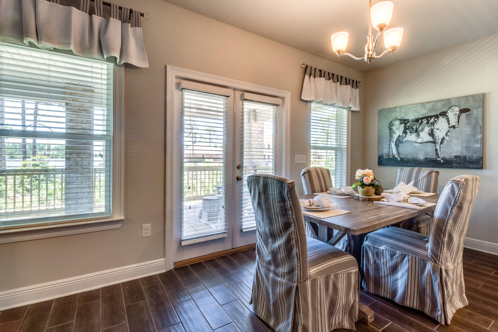 579 Golf Club Drive Santa Rosa Beach, FL 32459 - Photo 16 of 33 a view of a dining room with furniture window and wooden floor
