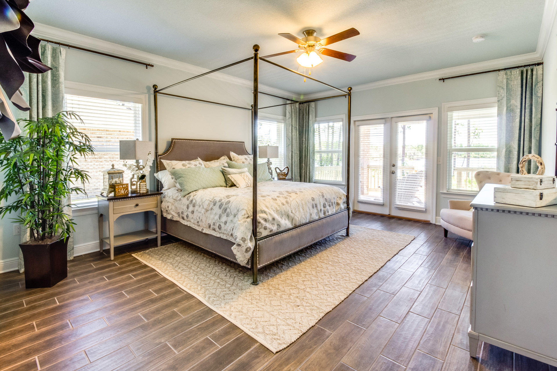 579 Golf Club Drive Santa Rosa Beach, FL 32459 - Photo 18 of 33 a bedroom with a bed and a potted plant on the dresser
