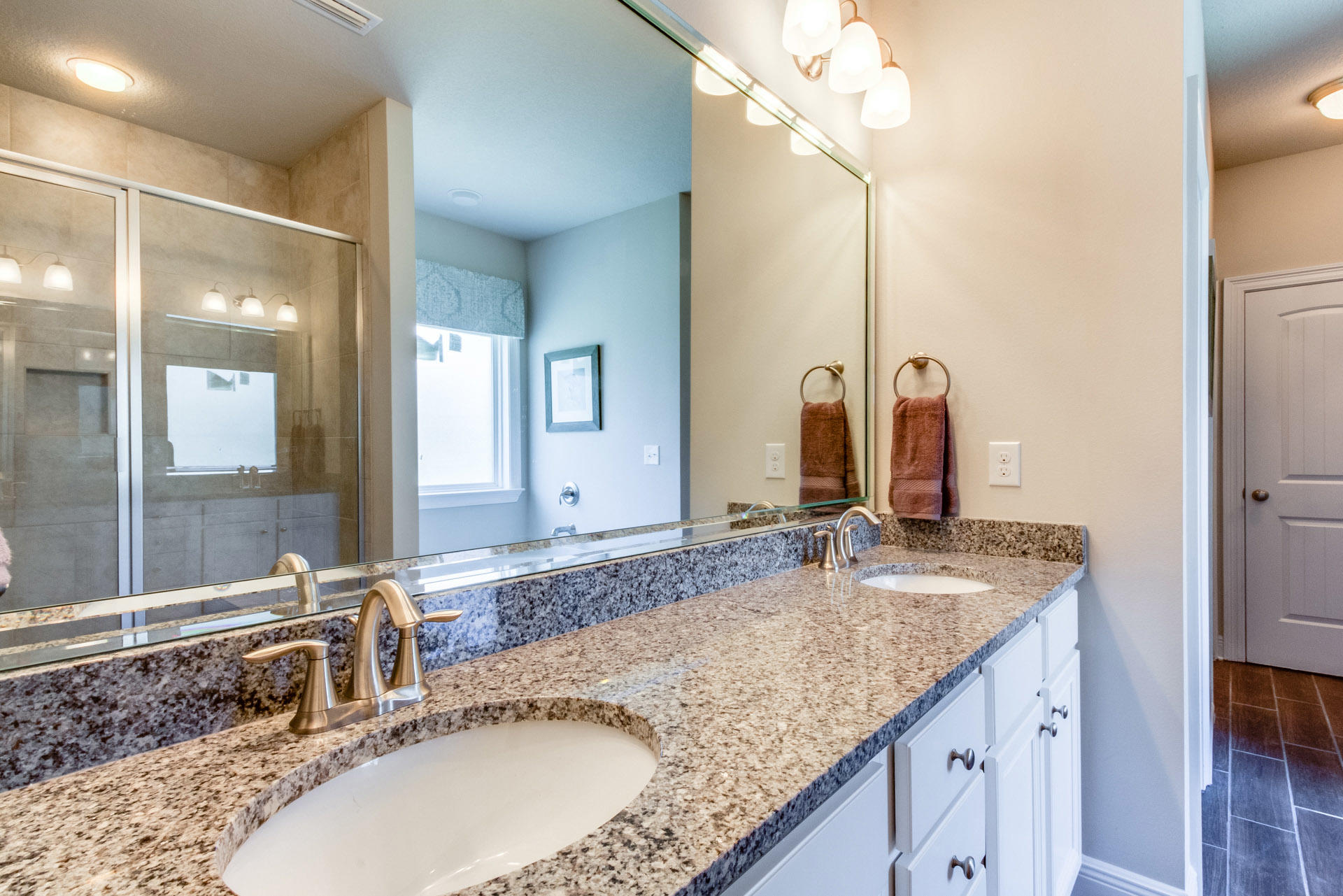 579 Golf Club Drive Santa Rosa Beach, FL 32459 - Photo 20 of 33 a bathroom with a granite countertop sink and a mirror
