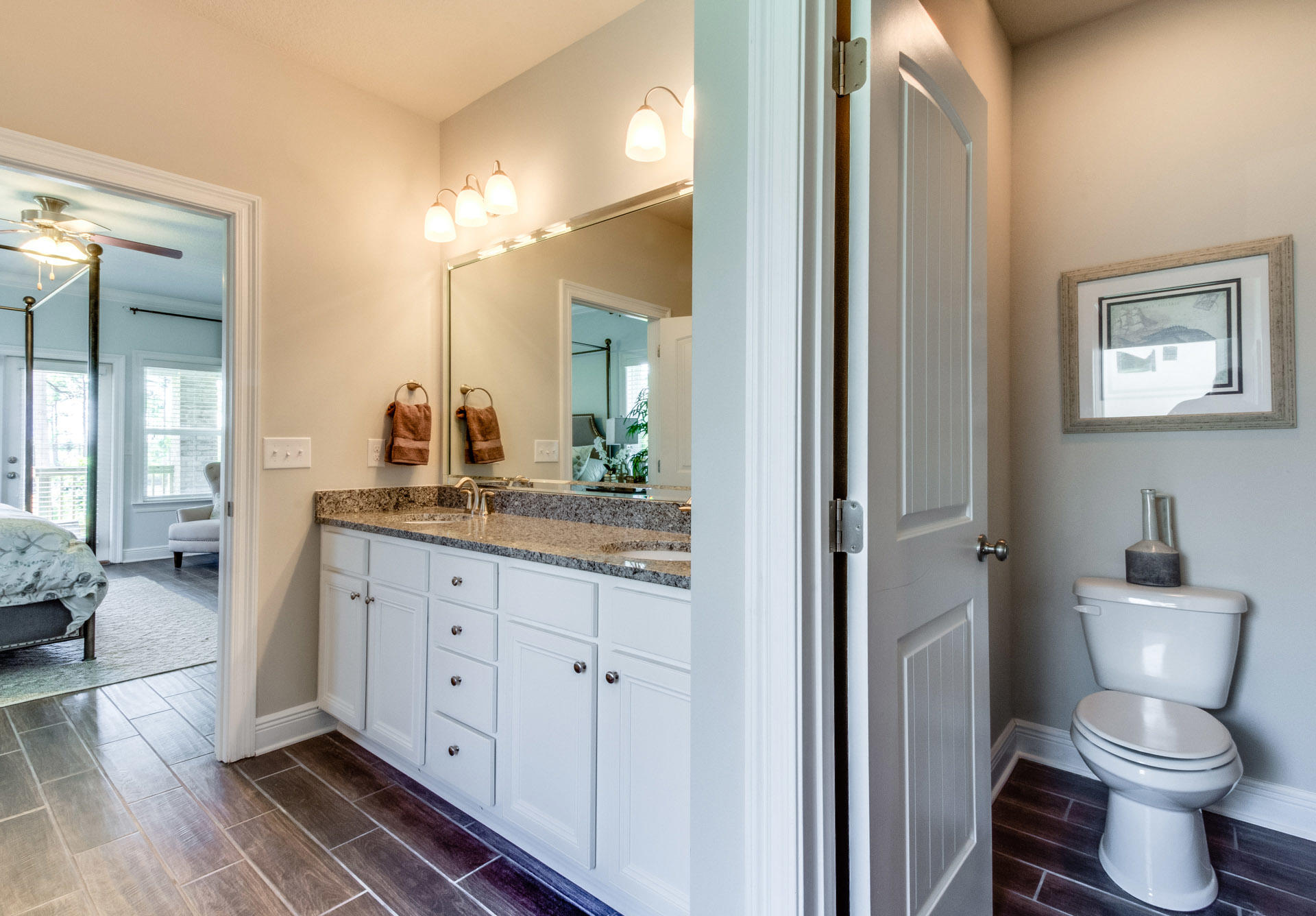 579 Golf Club Drive Santa Rosa Beach, FL 32459 - Photo 22 of 33 a bathroom with a toilet sink and a mirror