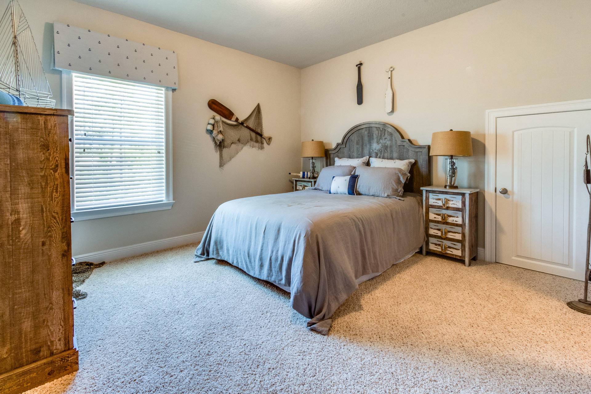 579 Golf Club Drive Santa Rosa Beach, FL 32459 - Photo 26 of 33 a bedroom with a bed and a window
