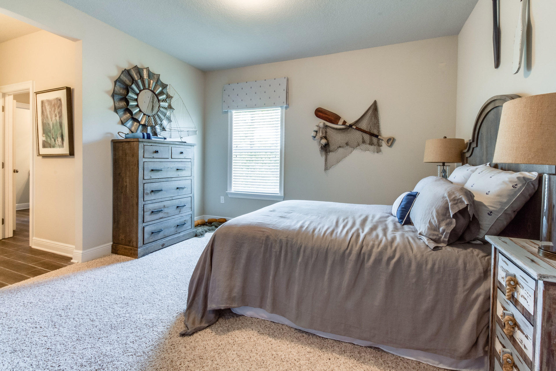 579 Golf Club Drive Santa Rosa Beach, FL 32459 - Photo 27 of 33 a bedroom with a bed and a chandelier