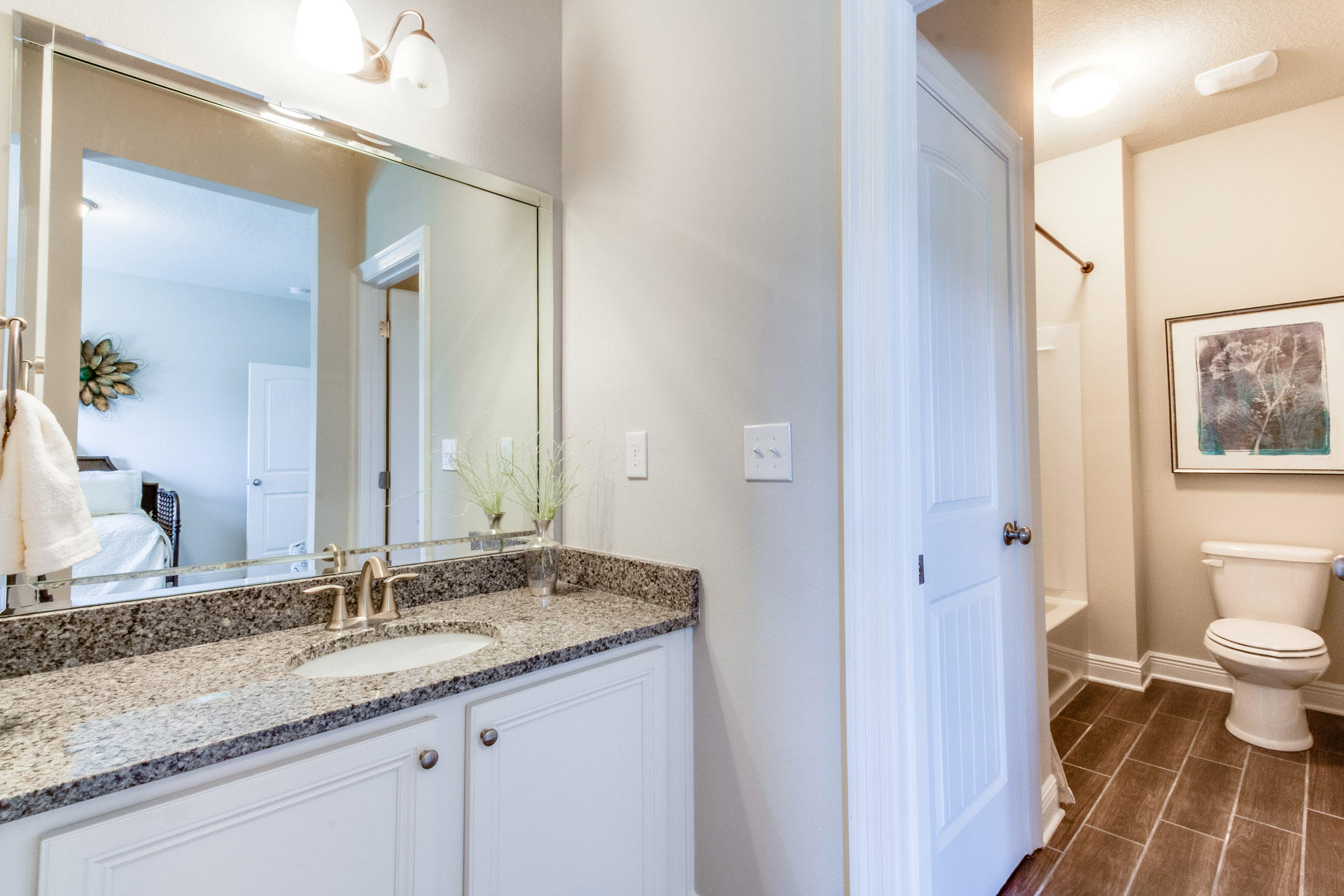 579 Golf Club Drive Santa Rosa Beach, FL 32459 - Photo 28 of 33 a bathroom with a granite countertop sink and a mirror