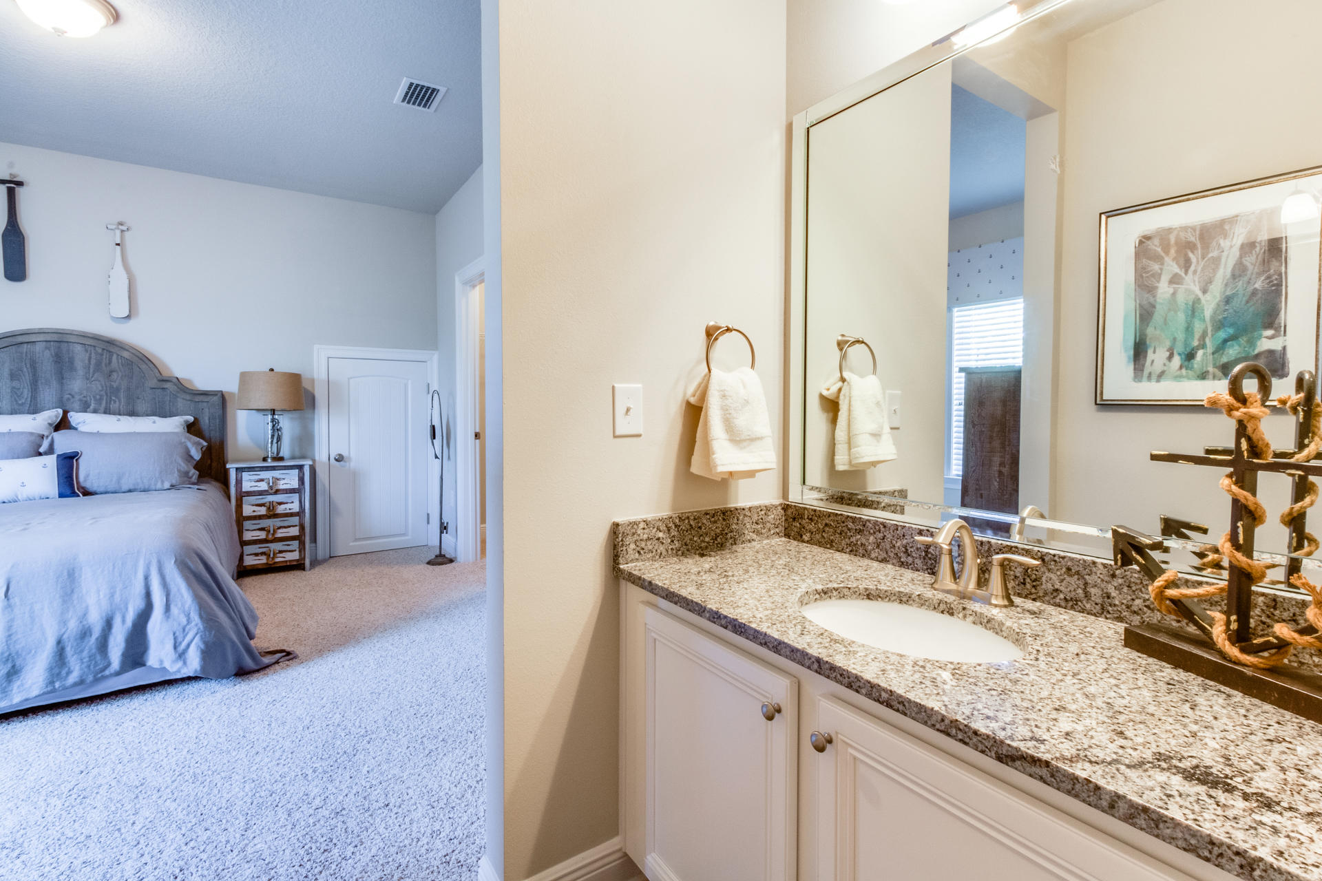 579 Golf Club Drive Santa Rosa Beach, FL 32459 - Photo 32 of 33 a en suite bathroom with a granite countertop sink and a mirror
