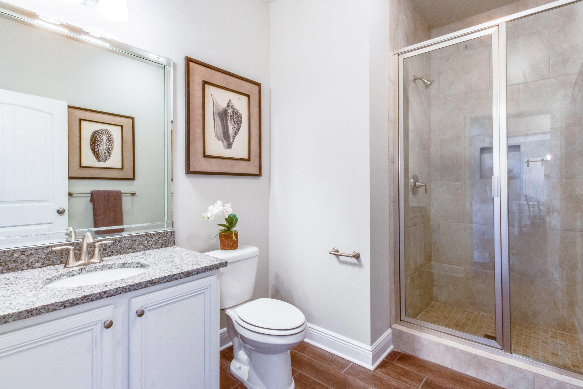 579 Golf Club Drive Santa Rosa Beach, FL 32459 - Photo 7 of 33 a bathroom with a granite countertop toilet sink and shower