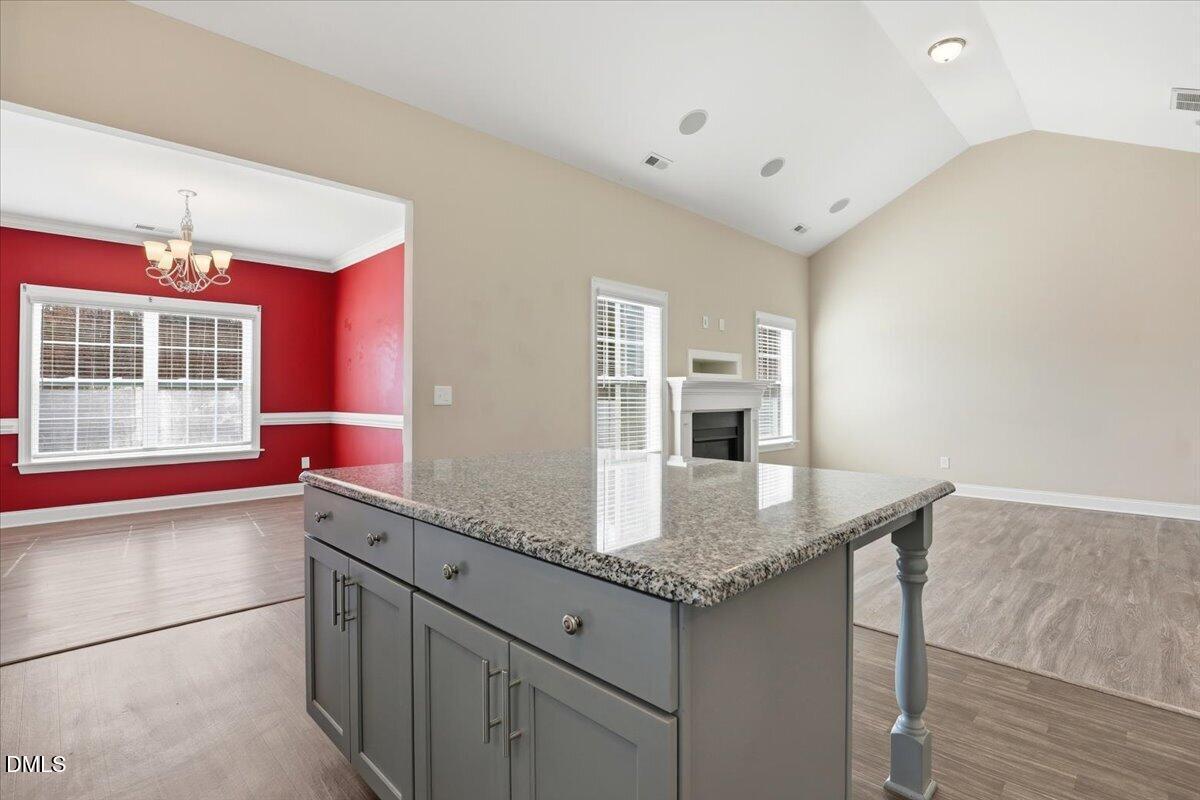 157 Ramsgate Drive Clayton, NC 27520 - Photo 11 of 42 a kitchen with stainless steel appliances granite countertop a sink stove and cabinets