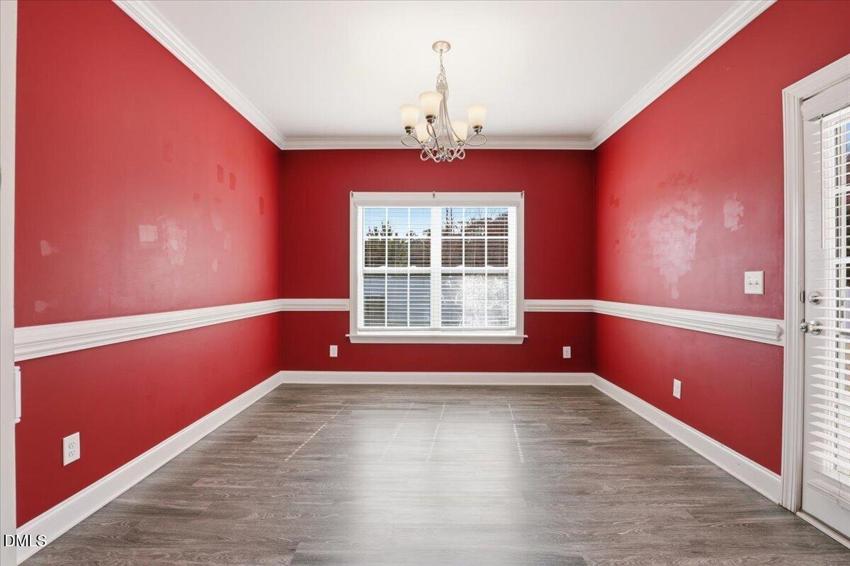 157 Ramsgate Drive Clayton, NC 27520 - Photo 14 of 42 a view of empty room with wooden floor and fan