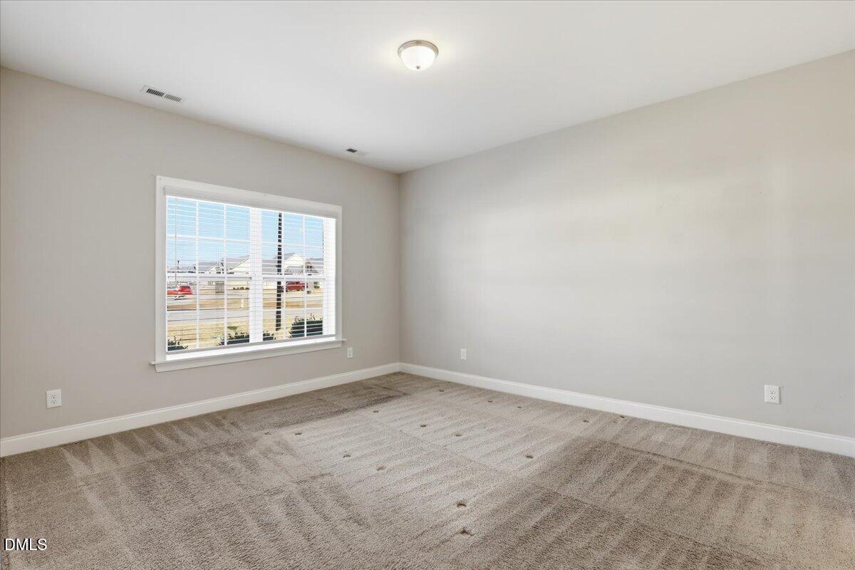 157 Ramsgate Drive Clayton, NC 27520 - Photo 17 of 42 an empty room with a window