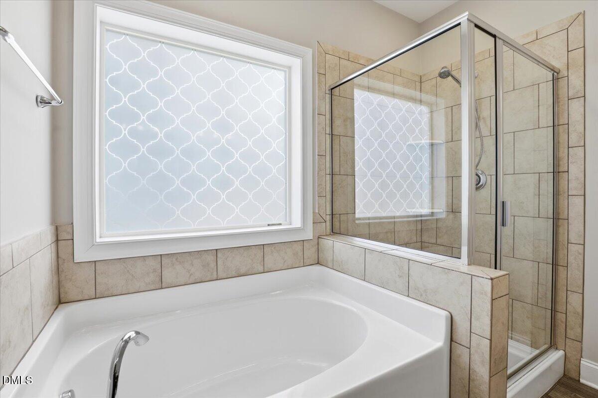 157 Ramsgate Drive Clayton, NC 27520 - Photo 20 of 42 a white bath tub with a shower