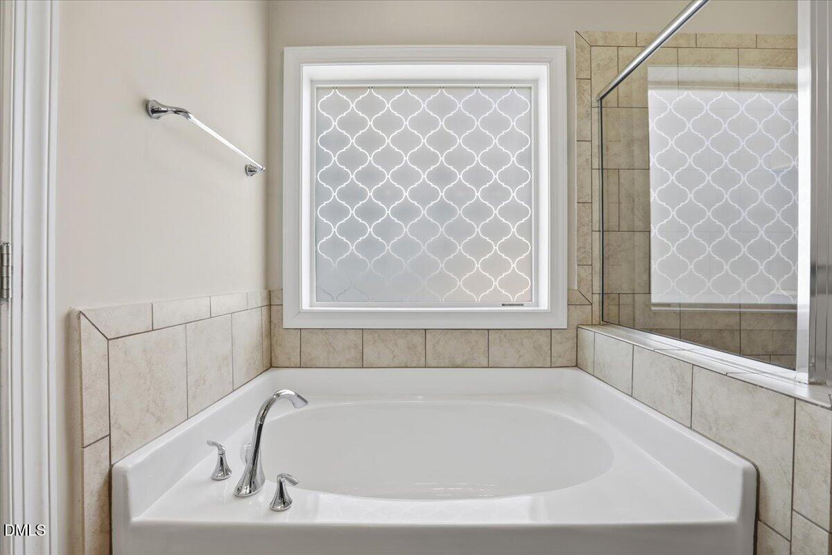 157 Ramsgate Drive Clayton, NC 27520 - Photo 21 of 42 a bathroom with a bathtub