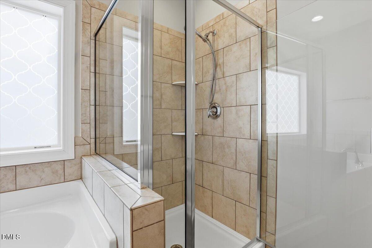 157 Ramsgate Drive Clayton, NC 27520 - Photo 22 of 42 a bathroom with a bathtub and shower