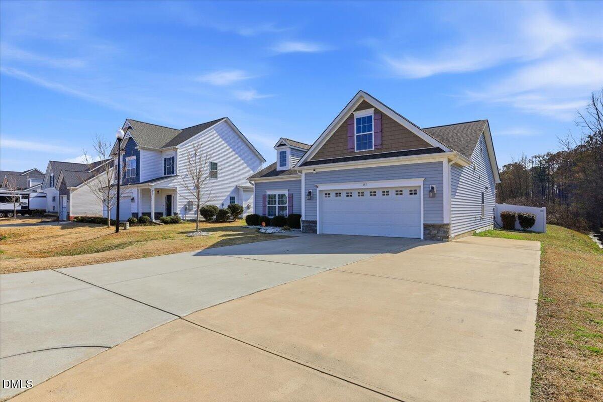 157 Ramsgate Drive Clayton, NC 27520 - Photo 2 of 42 a view of a house with a big yard