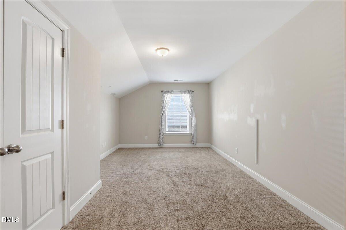 157 Ramsgate Drive Clayton, NC 27520 - Photo 28 of 42 an empty room with windows
