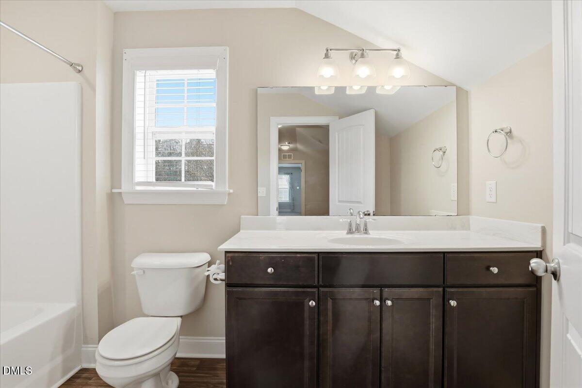 157 Ramsgate Drive Clayton, NC 27520 - Photo 30 of 42 a bathroom with a sink vanity mirror and toilet