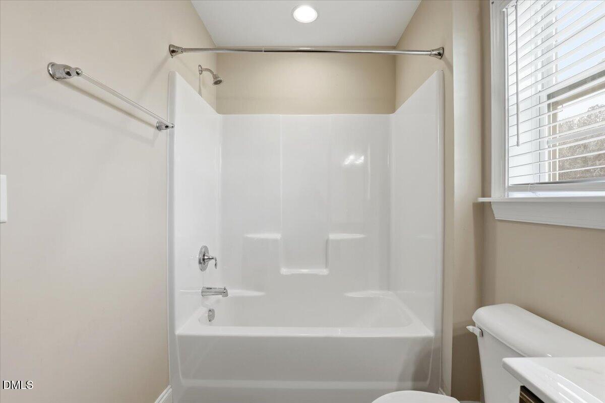 157 Ramsgate Drive Clayton, NC 27520 - Photo 31 of 42 a bathroom with a bathtub and a shower