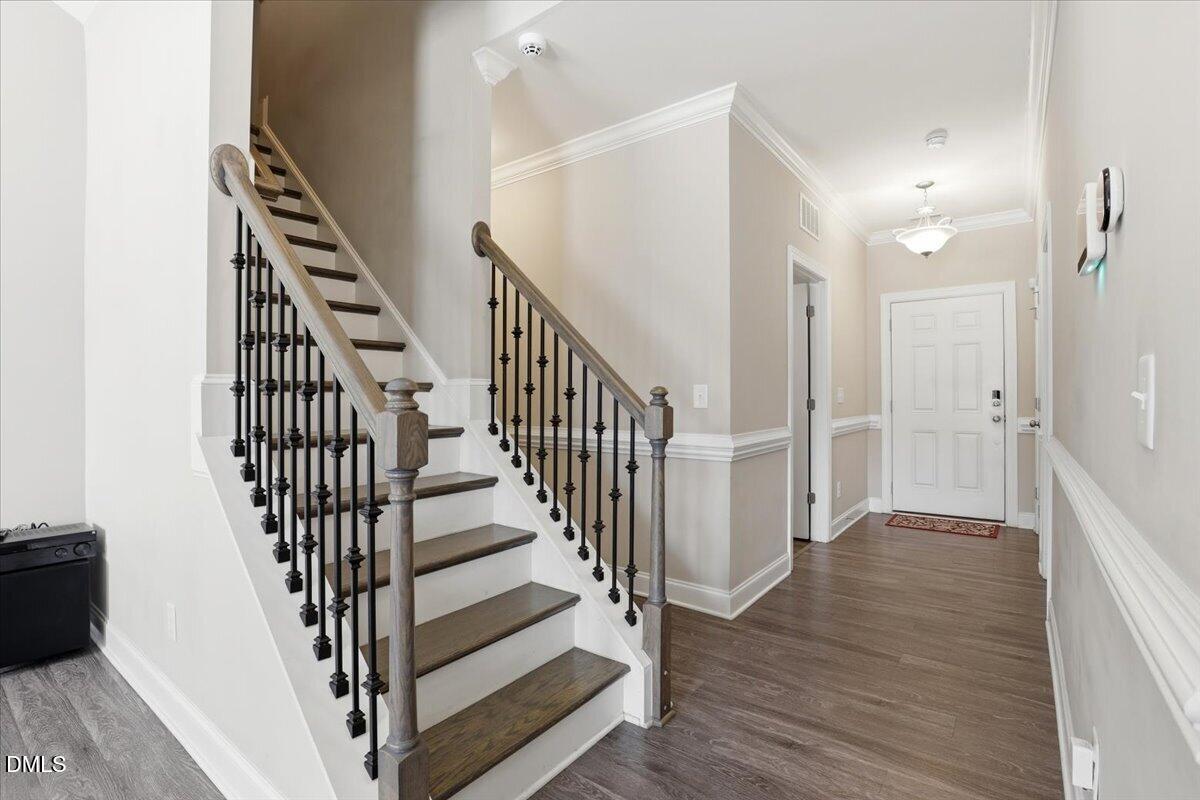 157 Ramsgate Drive Clayton, NC 27520 - Photo 33 of 42 a view of a hallway with wooden floor and entryway