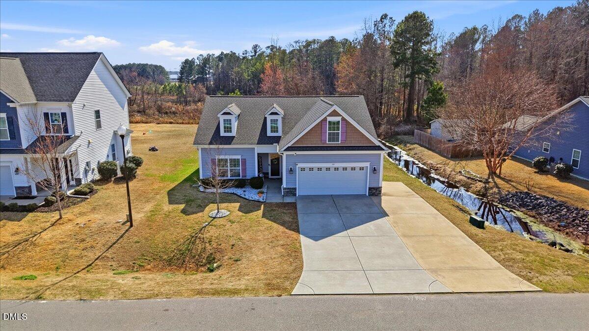 157 Ramsgate Drive Clayton, NC 27520 - Photo 3 of 42 a front view of a house with swimming pool