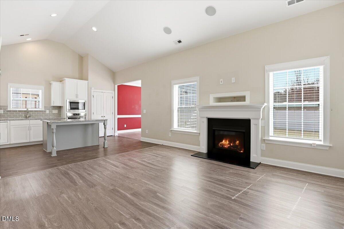 157 Ramsgate Drive Clayton, NC 27520 - Photo 5 of 42 a view of kitchen with furniture and fireplace