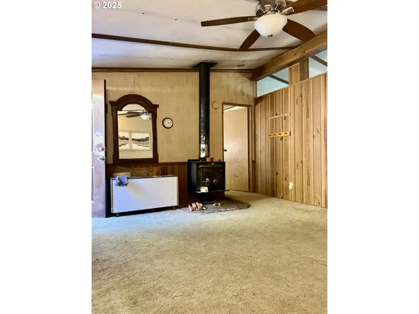a kitchen with kitchen island stainless steel appliances a sink and refrigerator