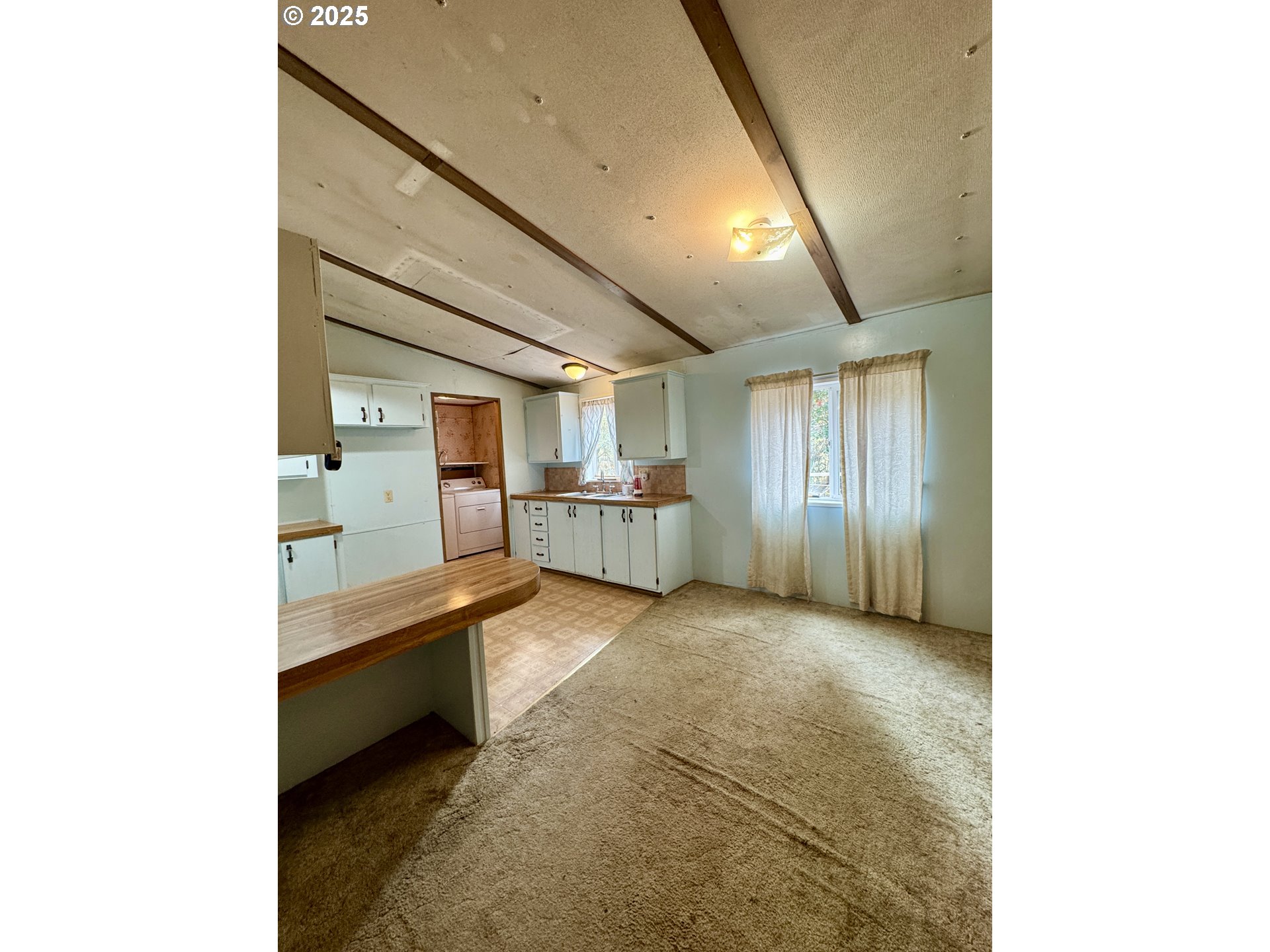 2263 Canyonville-Riddle Road Riddle, OR 97469 - Photo 8 of 36 a view of a kitchen with furniture and a kitchen