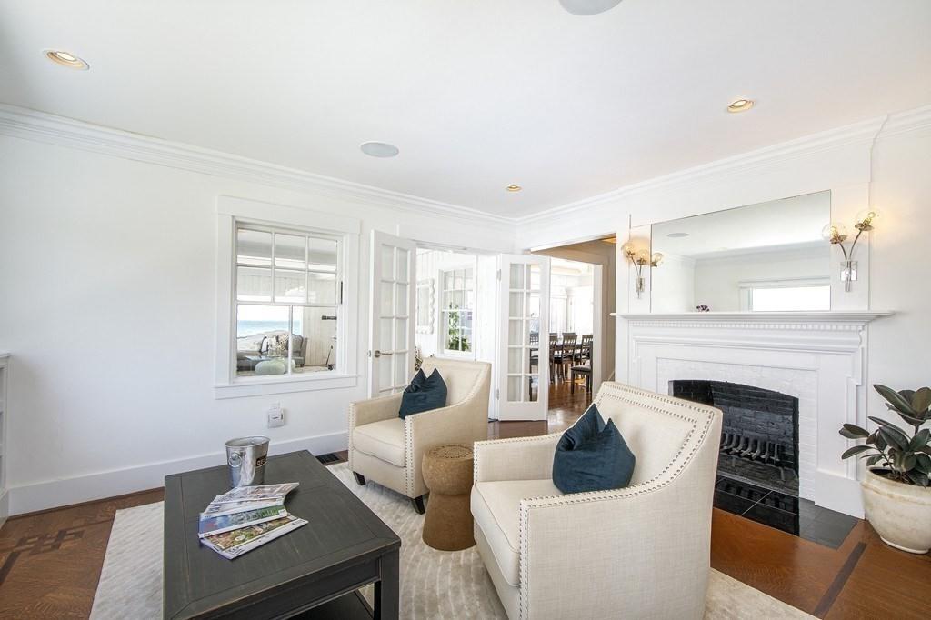 43 Surfside Road Scituate, MA 02066 - Photo 13 of 40 a living room with furniture and a fireplace