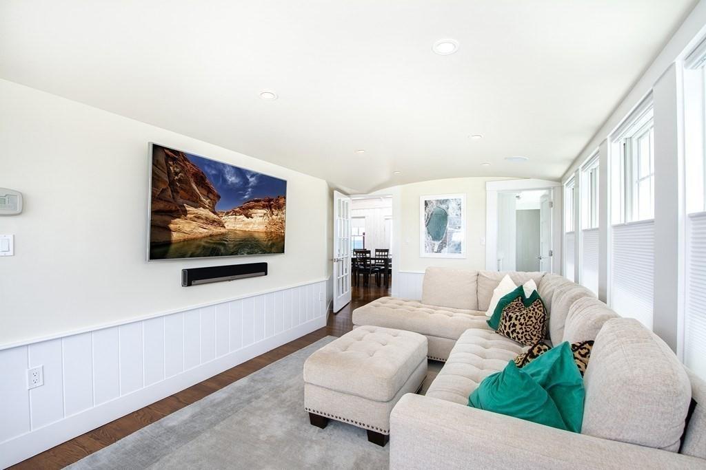 43 Surfside Road Scituate, MA 02066 - Photo 14 of 40 a living room with furniture and a flat screen tv