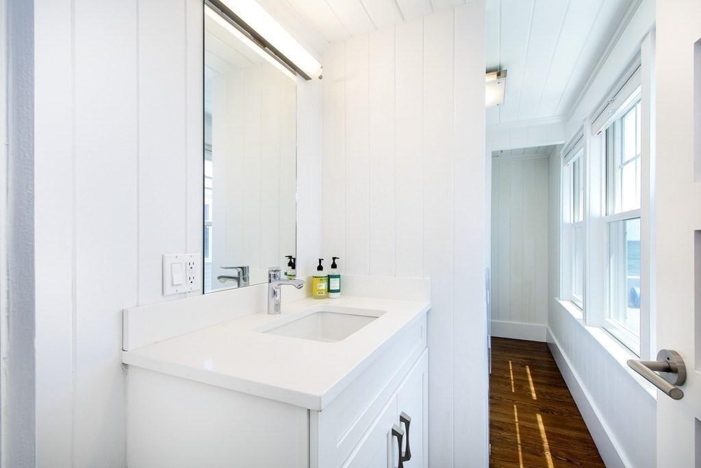 43 Surfside Road Scituate, MA 02066 - Photo 19 of 40 a bathroom with a sink and a bathtub