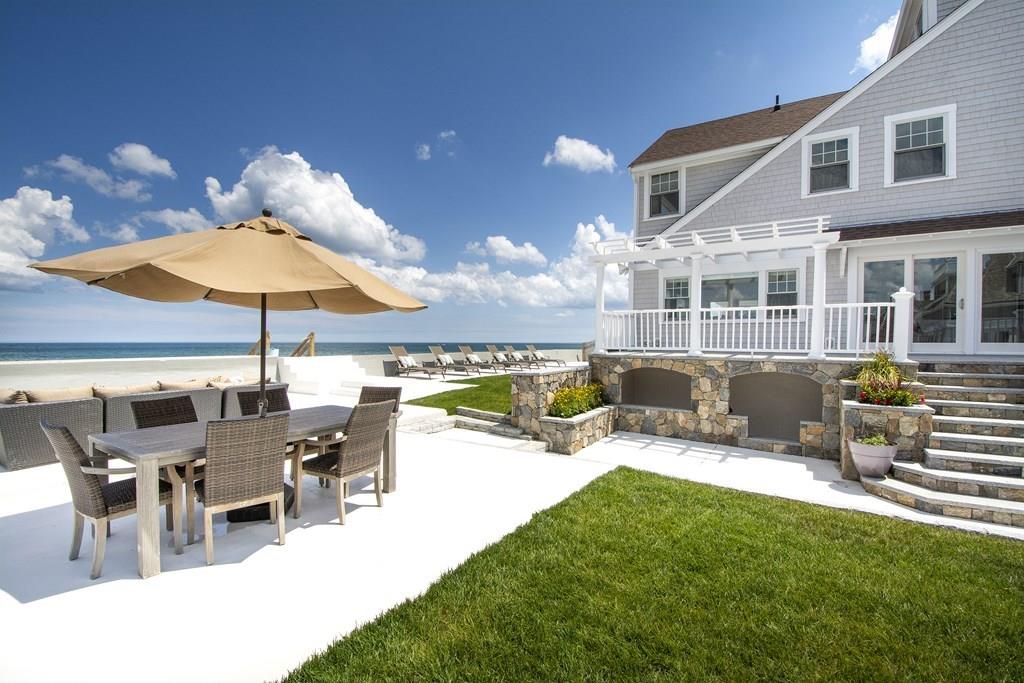 43 Surfside Road Scituate, MA 02066 - Photo 2 of 40 a view of a patio with a table chairs and a swimming pool